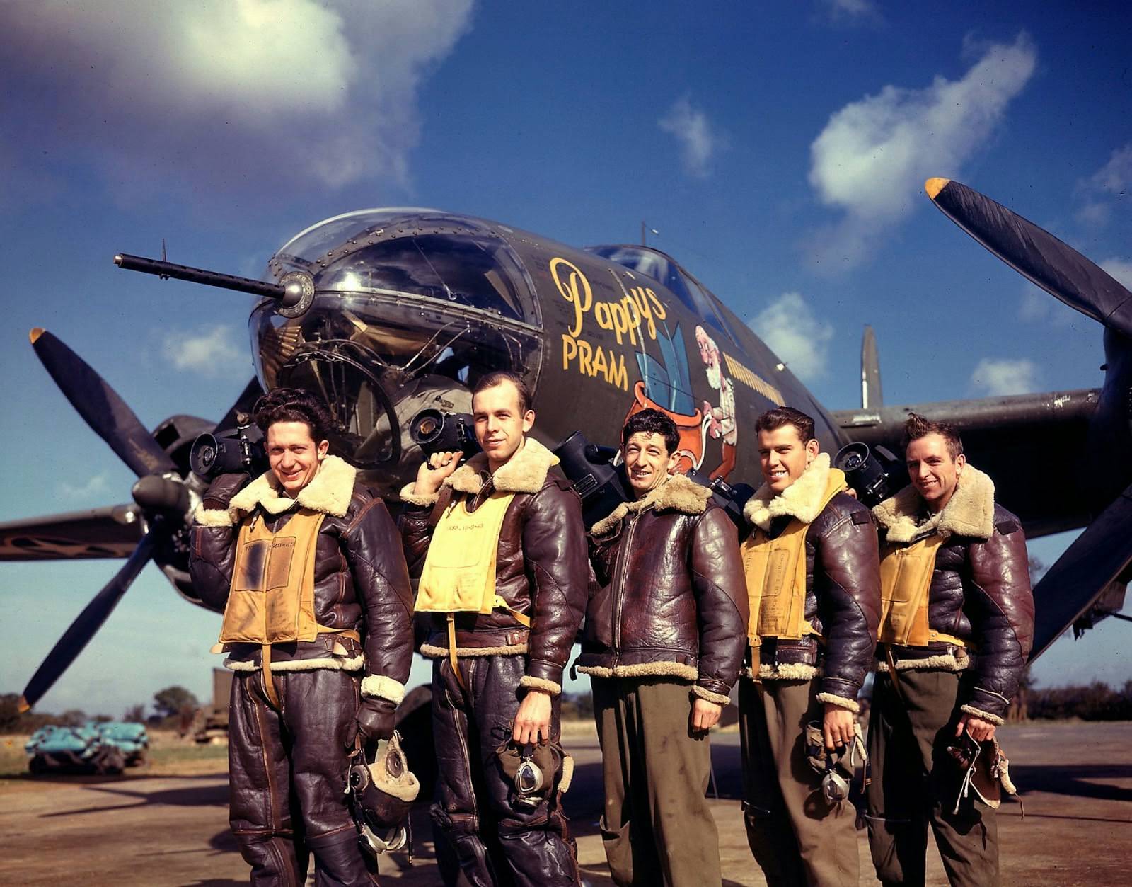 Photographers standing in front of Pappy's Pram, a B-26 Marauder at base, 1943.