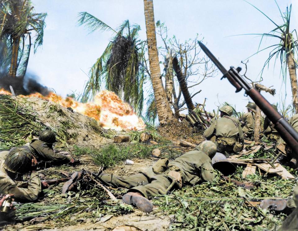 US soldiers of the 7th Infantry Division attacking a Japanese blockhouse on Kwajalein in the Marshall Islands in 1944. The troops began capturing the islands by landing their forces on the beaches.