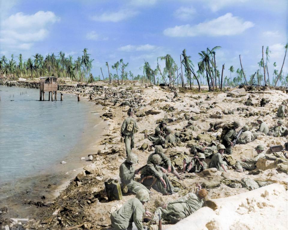 US marines huddled on the beaches during the Battle of Tarawa in World War Two, Kiribati, 1943.