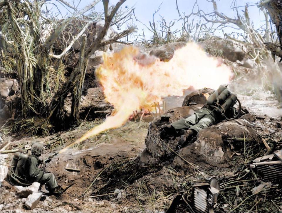 Marines torch a Japanese defensive in Iwo Jima’s Mount Suribachi by using flamethrowers in 1945. These military tools were an effective weapon for burning out entrenched fighters who would have otherwise continued to fight, costing more lives. Pictured are Pvt. Richard Klatt and PFC Wilfred Voegeli