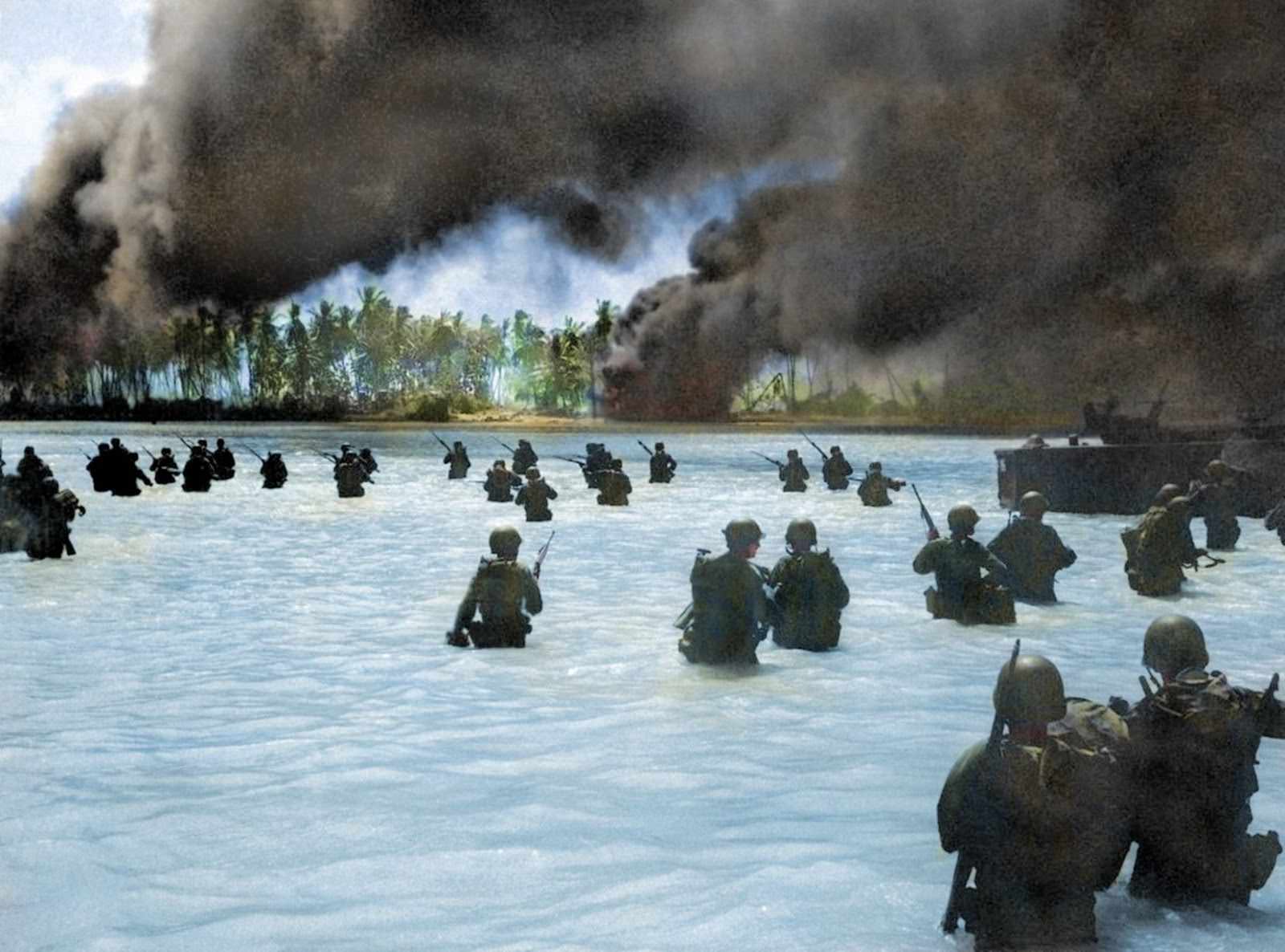 Men wade through the water near Butaritari Beach, Makin Atoll in November 1943.