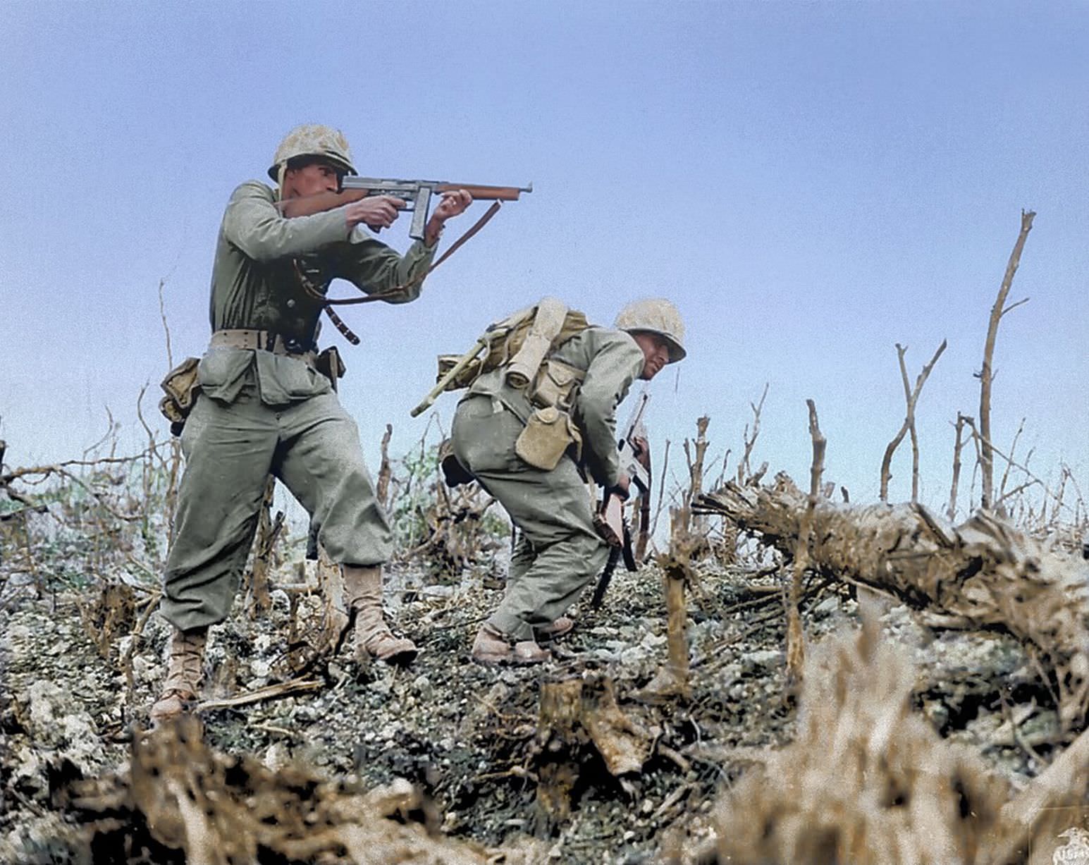 Two Marines from the 2nd Battalion, 1st Marine Regiment during fighting at Wana Ridge during the Battle of Okinawa, May 1945.