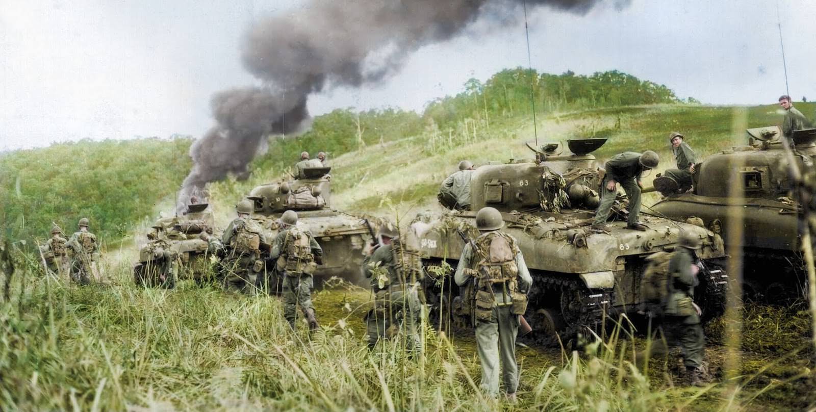 Troops and their tanks in New Guinea in April 1944.