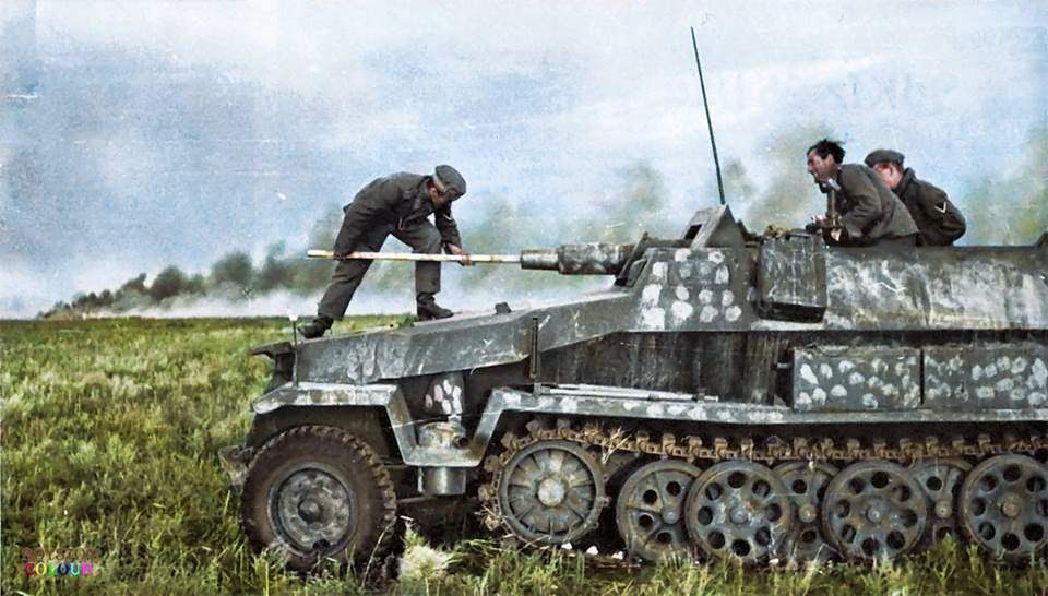 A crew member cleaning the barrel of an Sd.Kfz. 251/9 - Schützenpanzerwagen (7.5 cm KwK 37 L/24) "Stummel" on the East Front, c. Summer 1942.