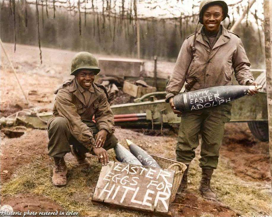 T/5 William E. Thomas and Pfc. Joseph Jackson prepare a gift of special “Easter Eggs” for Adolf Hitler and the German Army. Scrawling such messages on artillery shells in World War II was one way in which artillery soldiers could humorously express their dislike of the enemy.