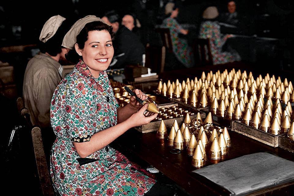 Girls working on shell caps in a munitions factory, somewhere in England. 25th of May 1940