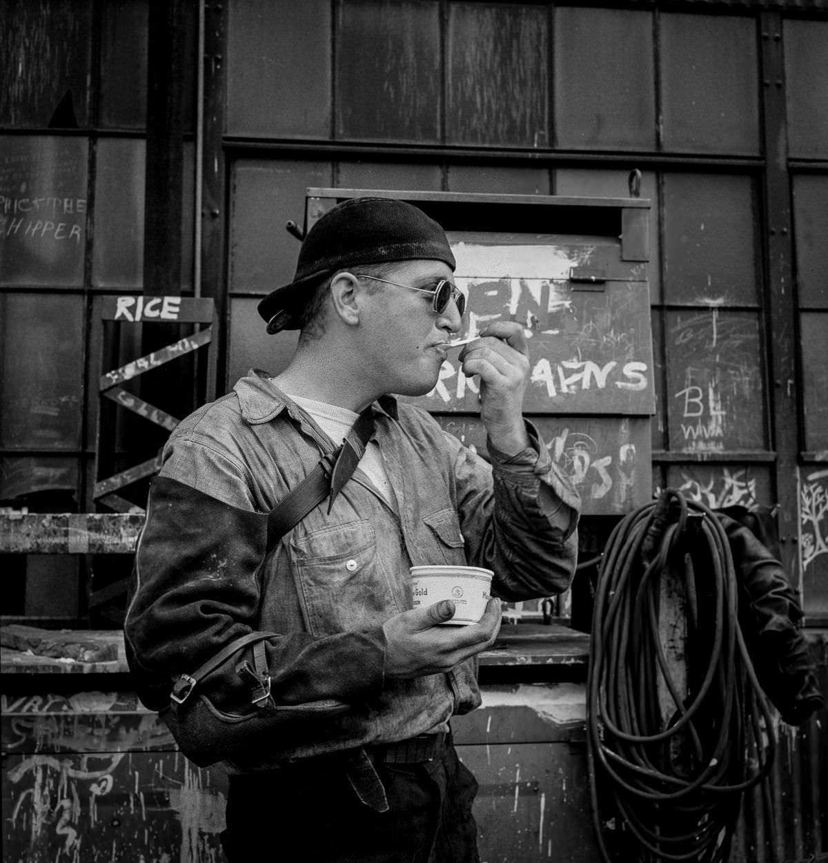 A welder enjoys some ice cream