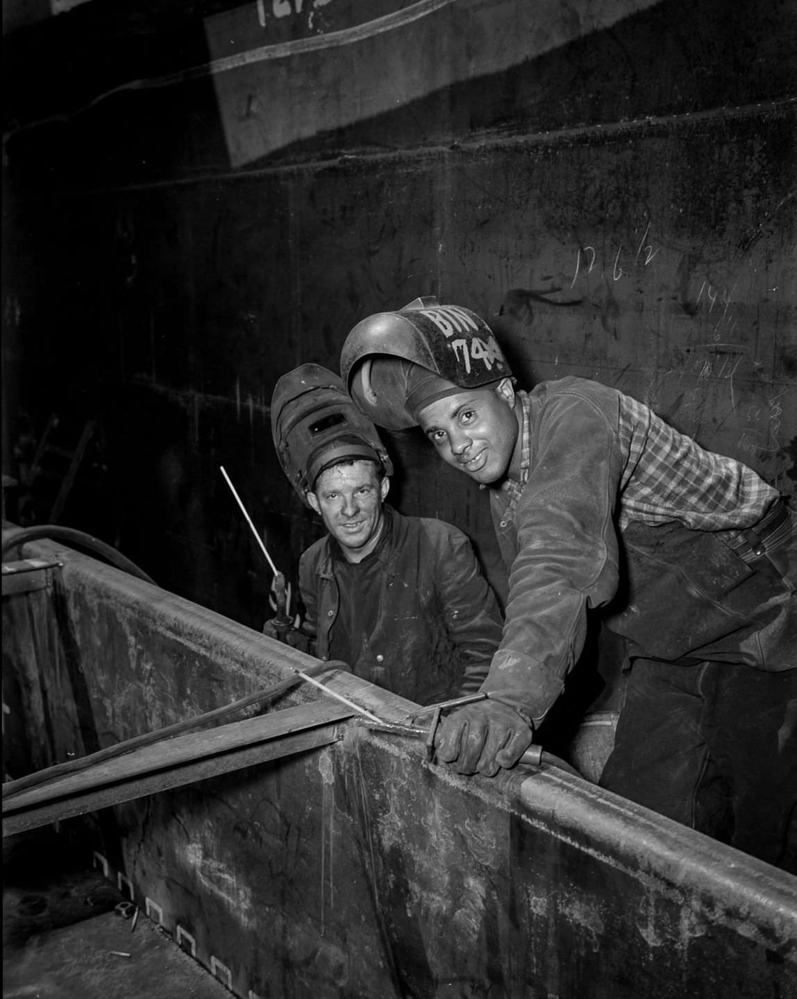 Rod welders work on the Liberty ship Frederick Douglass