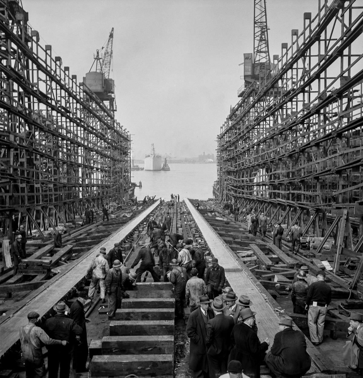 After a launch, workers fill the way and prepare to build another ship