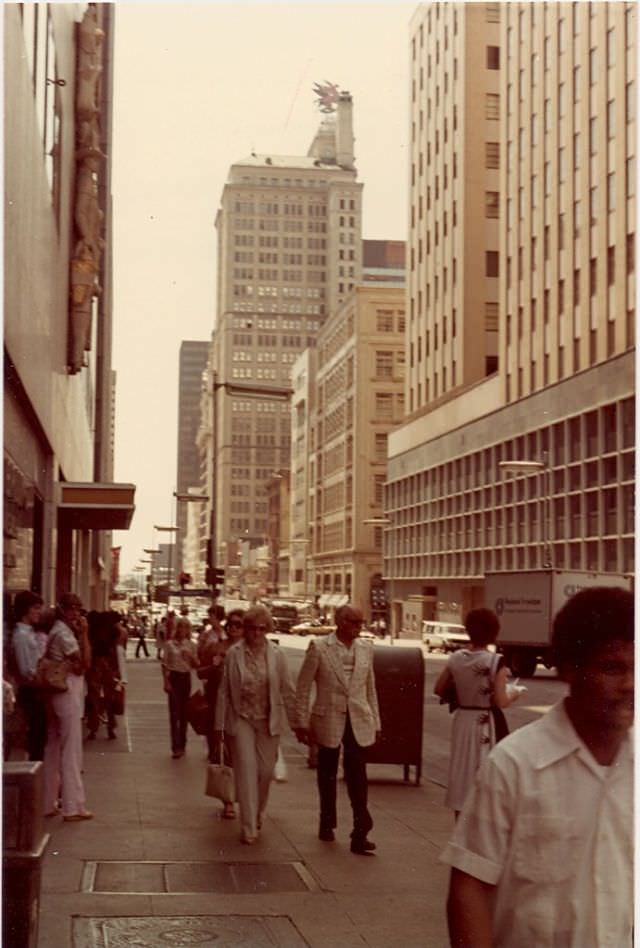 Humans walking on concrete sidewalks of Commerce Street, 1981