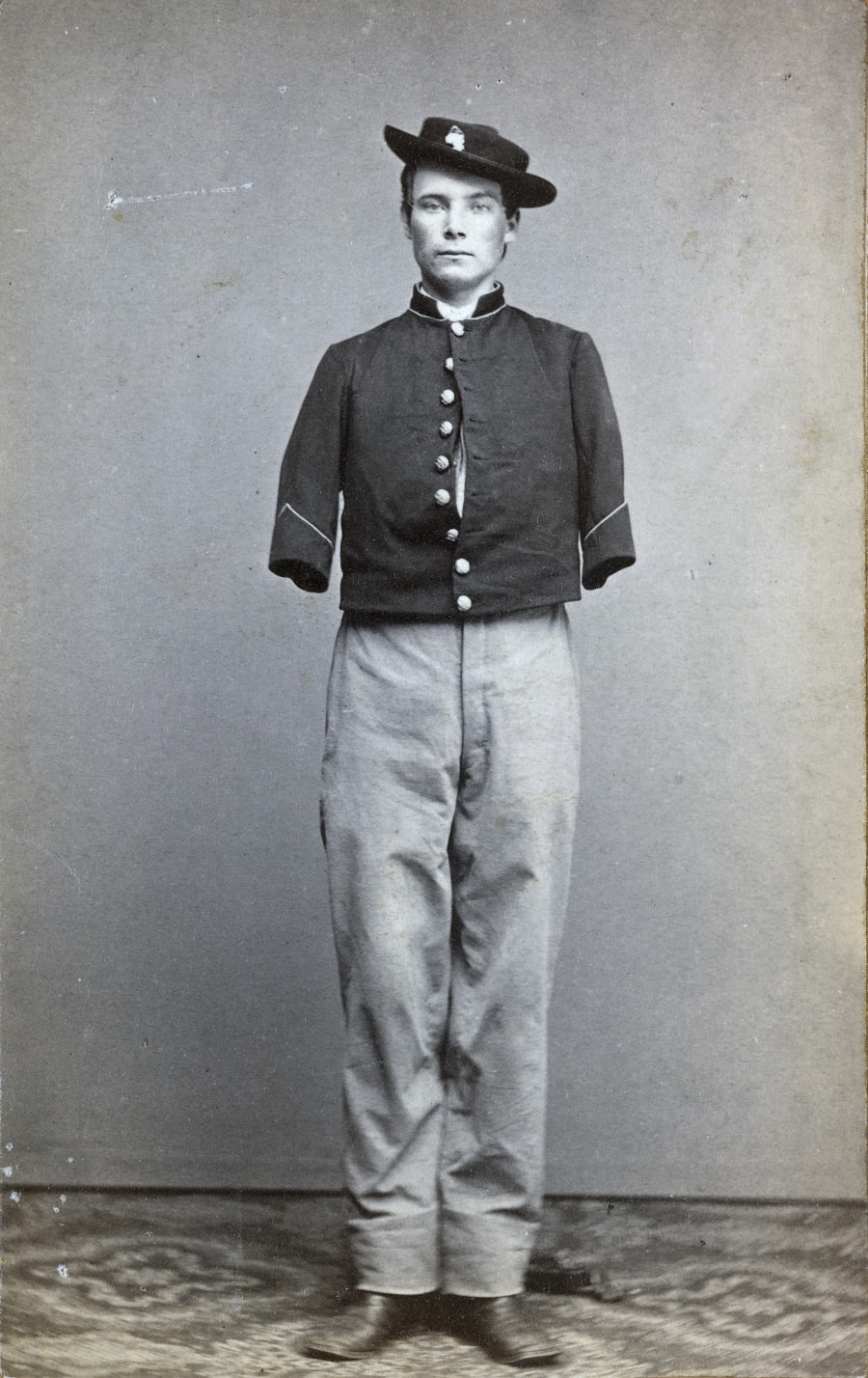 Private William Sergent of Co. E, 53rd Pennsylvania Infantry Regiment, in uniform, after the amputation of both arms. 1861.