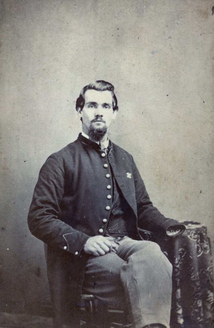 Sergeant Thomas Plunkett of Co. E, 21st Massachusetts Infantry Regiment in uniform with American flag, 1863.