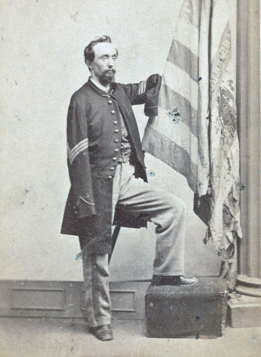Private Vernon Mosher of Co. F, 97th New York Infantry Regiment, in uniform, amputated hand visible, 1867.