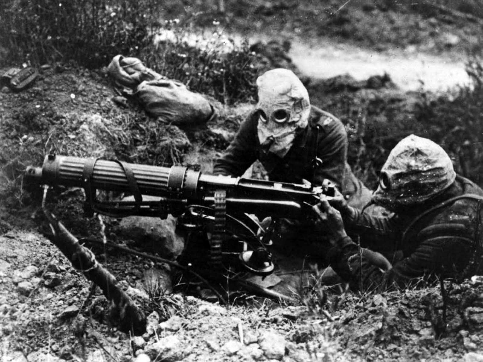 Gas-masked men of the British Machine Gun Corps with a Vickers machine gun.