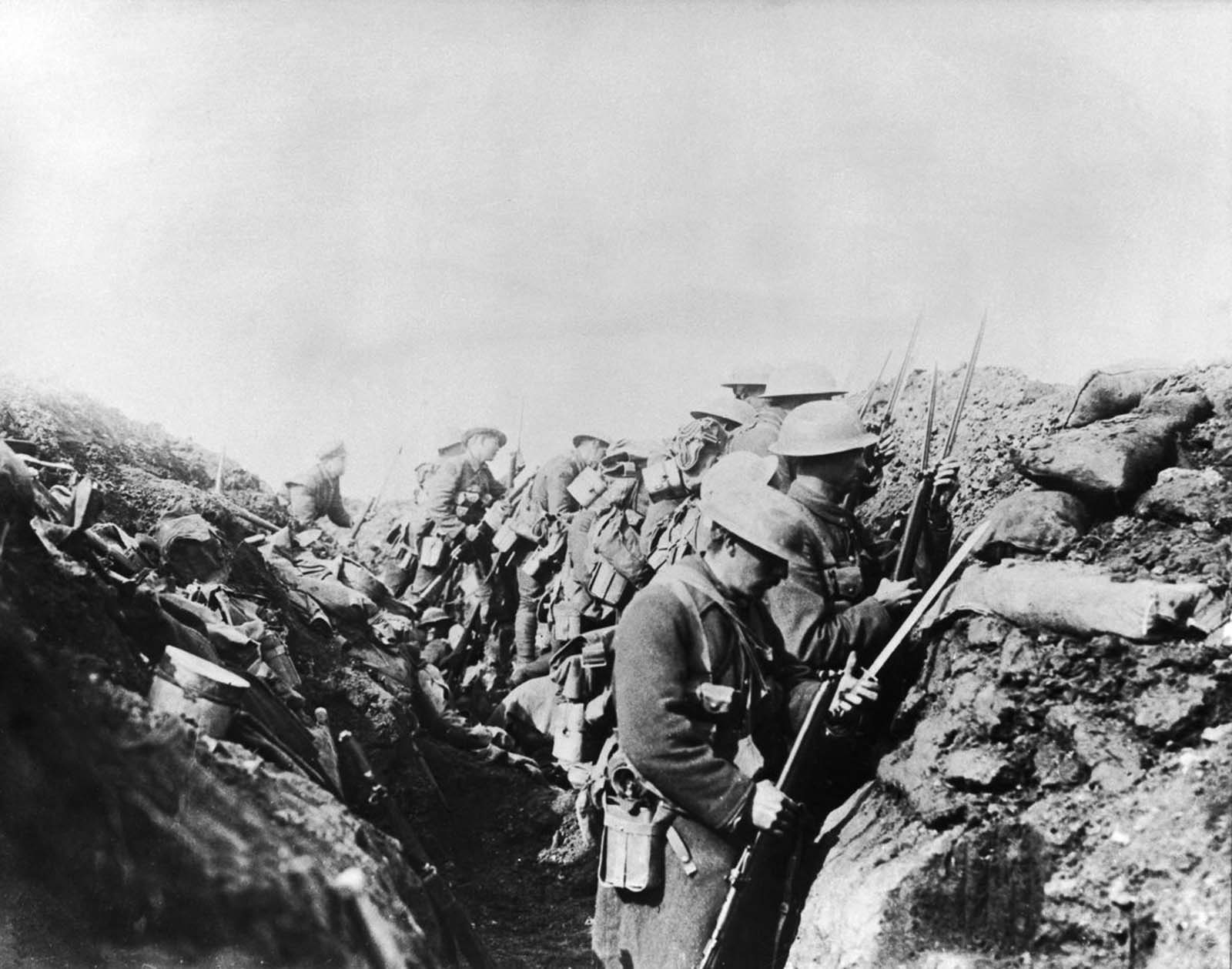 Canadian troops fix bayonets before going over the top to assault German positions.