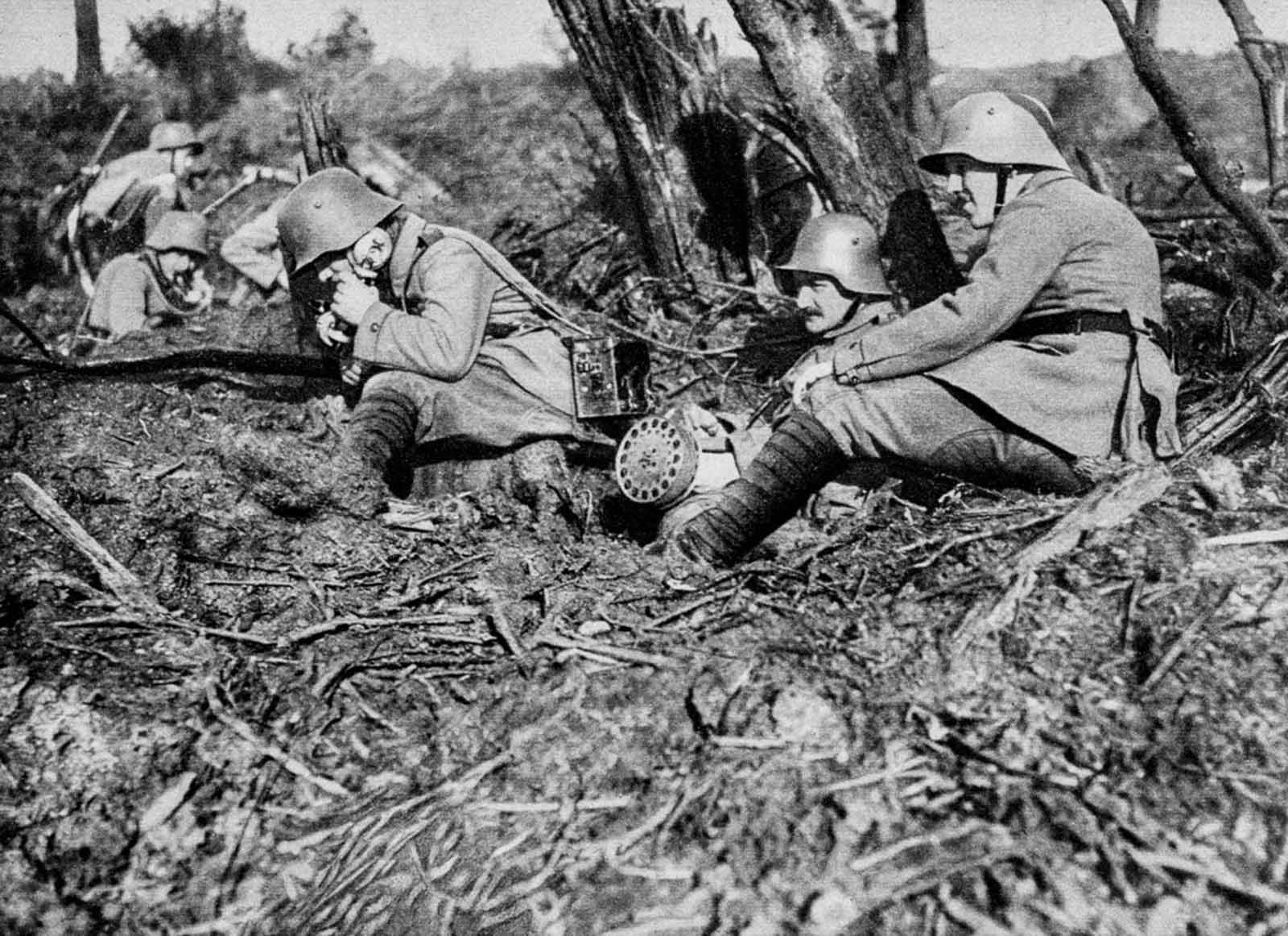 A German field telephonist relays artillery requests from the front lines.