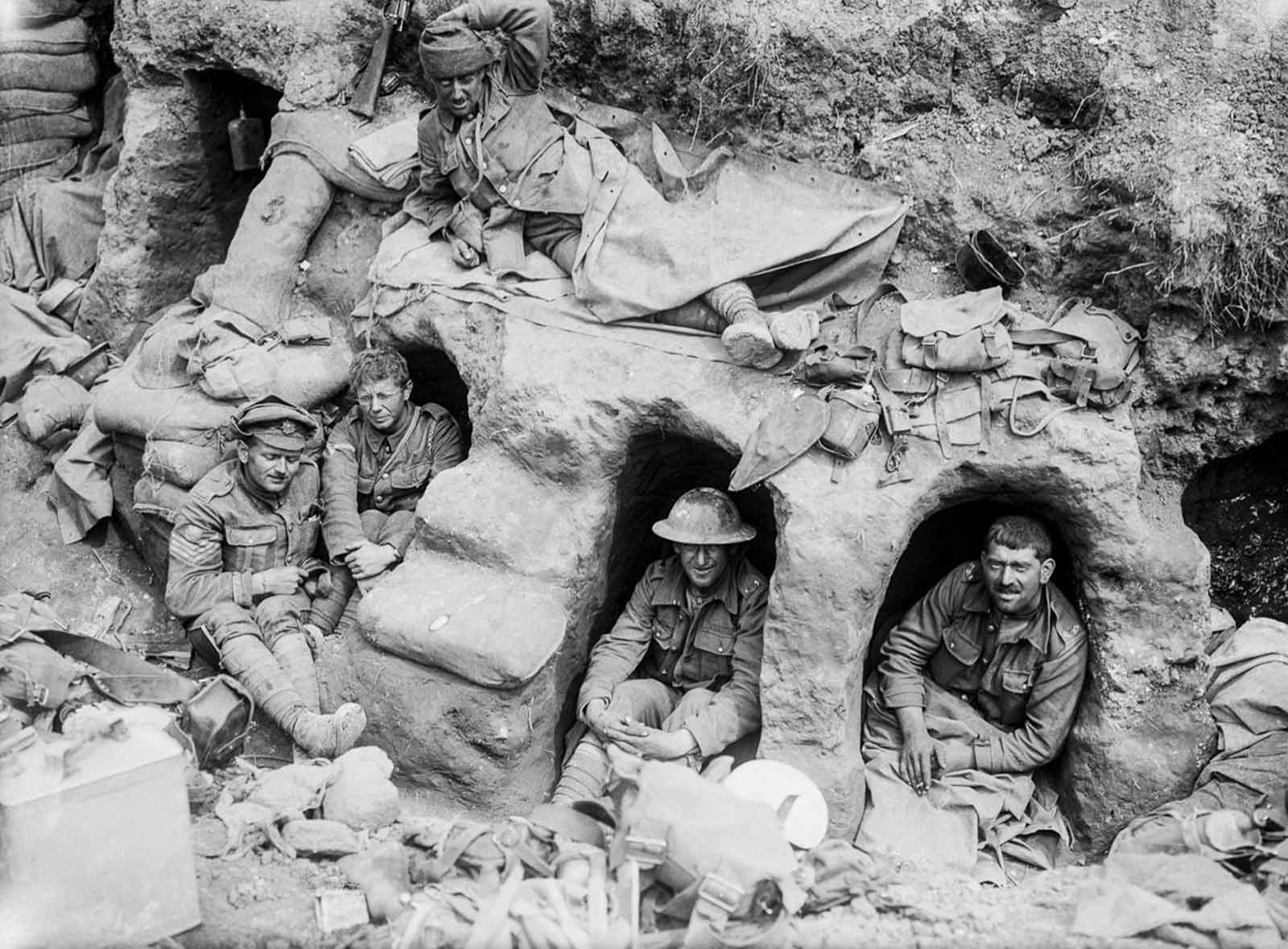 Men of the Border Regiment rest in shallow dugouts near Thiepval Wood. August, 1916.