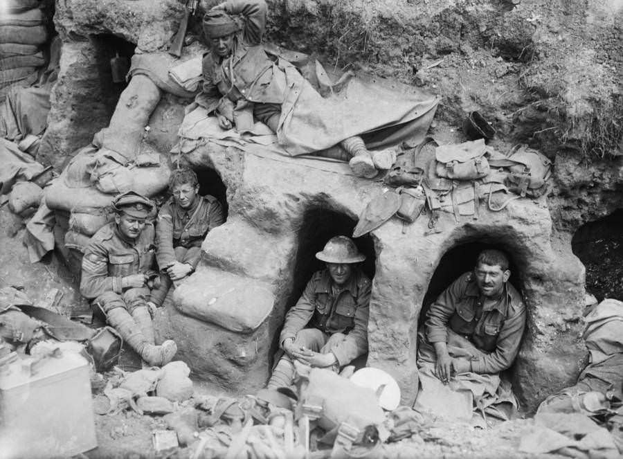 Men of the Border Regiment rest in shallow dugouts.