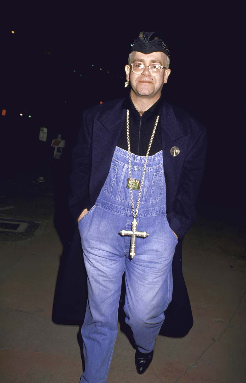 Overalls and a large cross necklace, 1991.