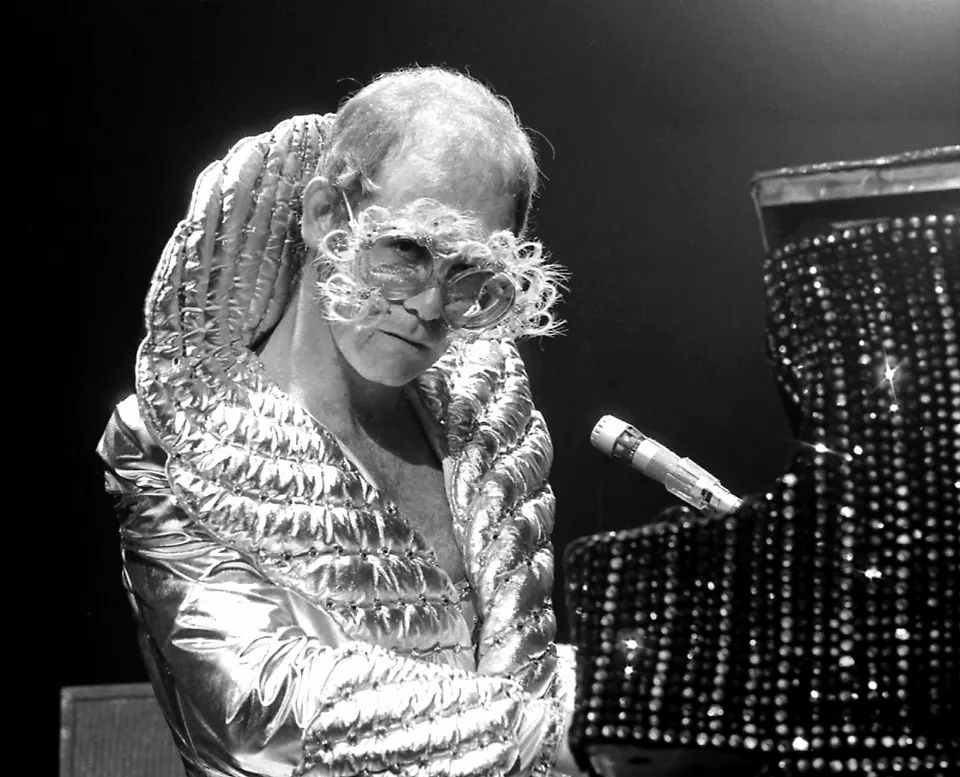 Elton John in metallic costume, 1974