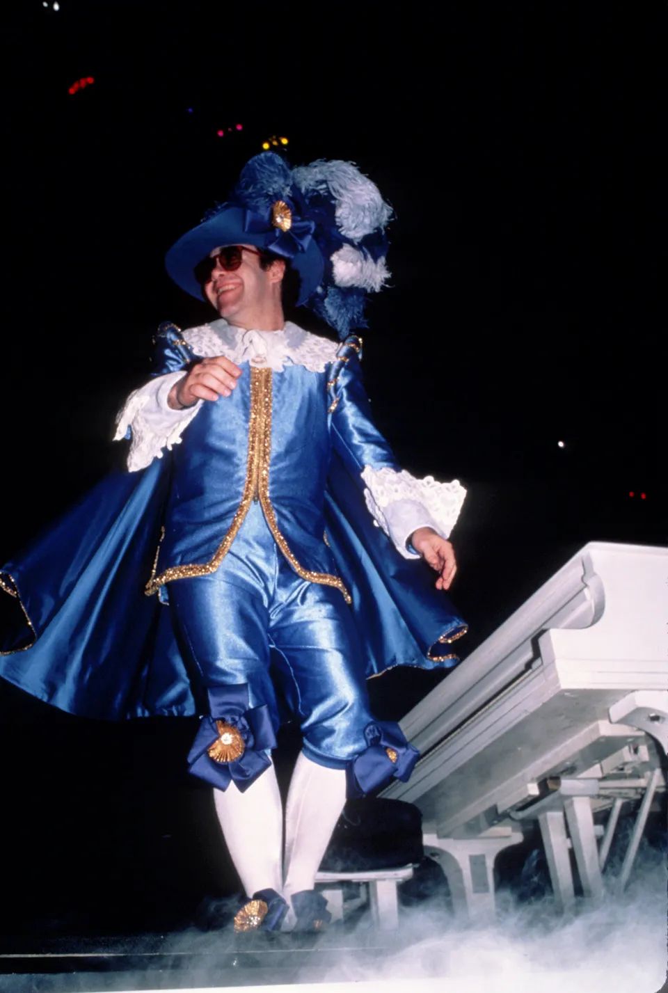 Elton John performing in rainbow array at Madison Square Garden in New York in August 1982