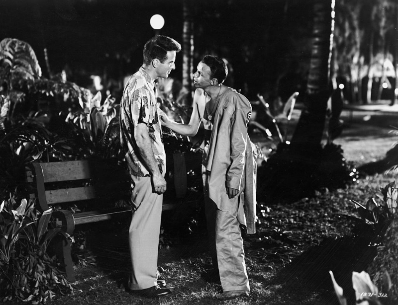 Montgomery Clift and Frank Sinatra talk in a still from the film 'From Here to Eternity,' 1953.