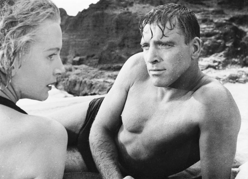 Burt Lancaster and Deborah Kerr get passionate on a beach in the classic love scene from the film 'From Here to Eternity,' 1953.