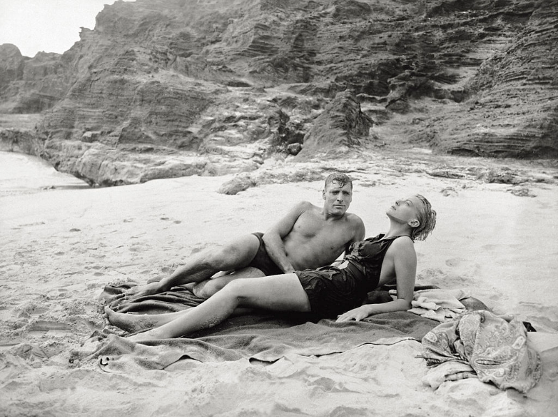 Burt Lancaster and Deborah Kerr lying together on the beach in a scene from the film 'From Here to Eternity,' 1953.