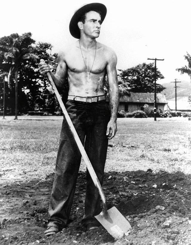 Montgomery Clift holds a shovel in a scene from the film 'From Here to Eternity,' 1953.