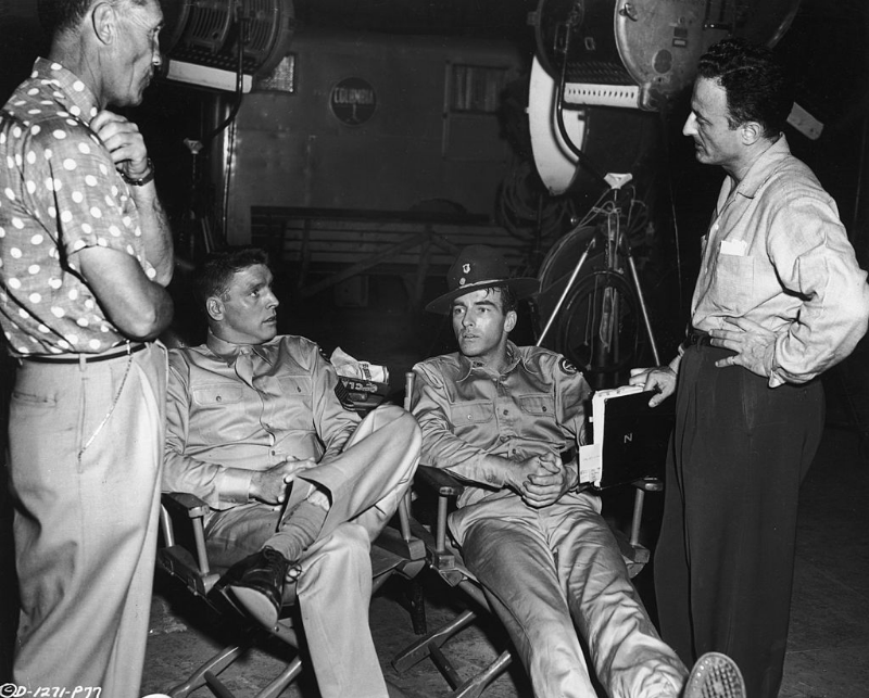 Technical advisor Mushy Callahan, Burt Lancaster, Montgomery Clift and director Fred Zinnemann speak between scenes on the set of 'From Here To Eternity,' 1953.