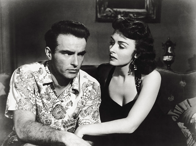 Montgomery Clift and Donna Reed dicussing, sitting down on a sofa, in 'From Here to Eternity,' 1953.