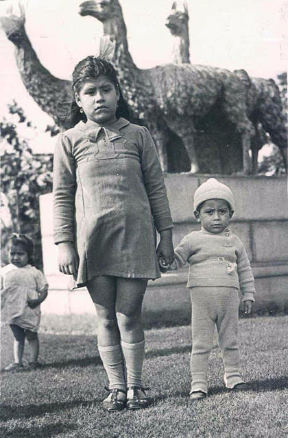 Lina with her 2-year-old son Gerardo and her baby doll.