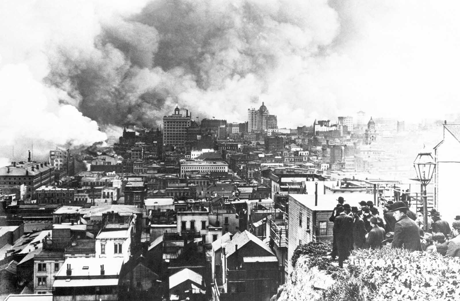 A crowd gathers on Telegraph Hill to watch the burning of San Francisco. The view is looking south.