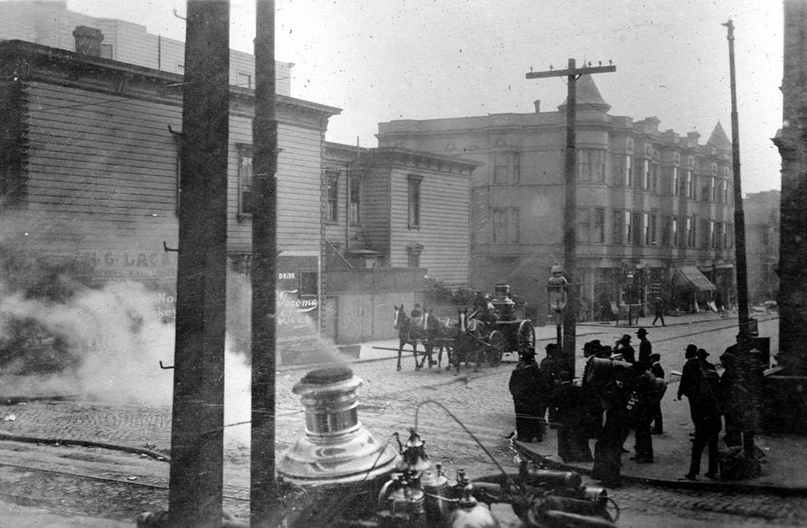 A horse-drawn fire engine retires from a fire to move to a new location on April 19, 1906.