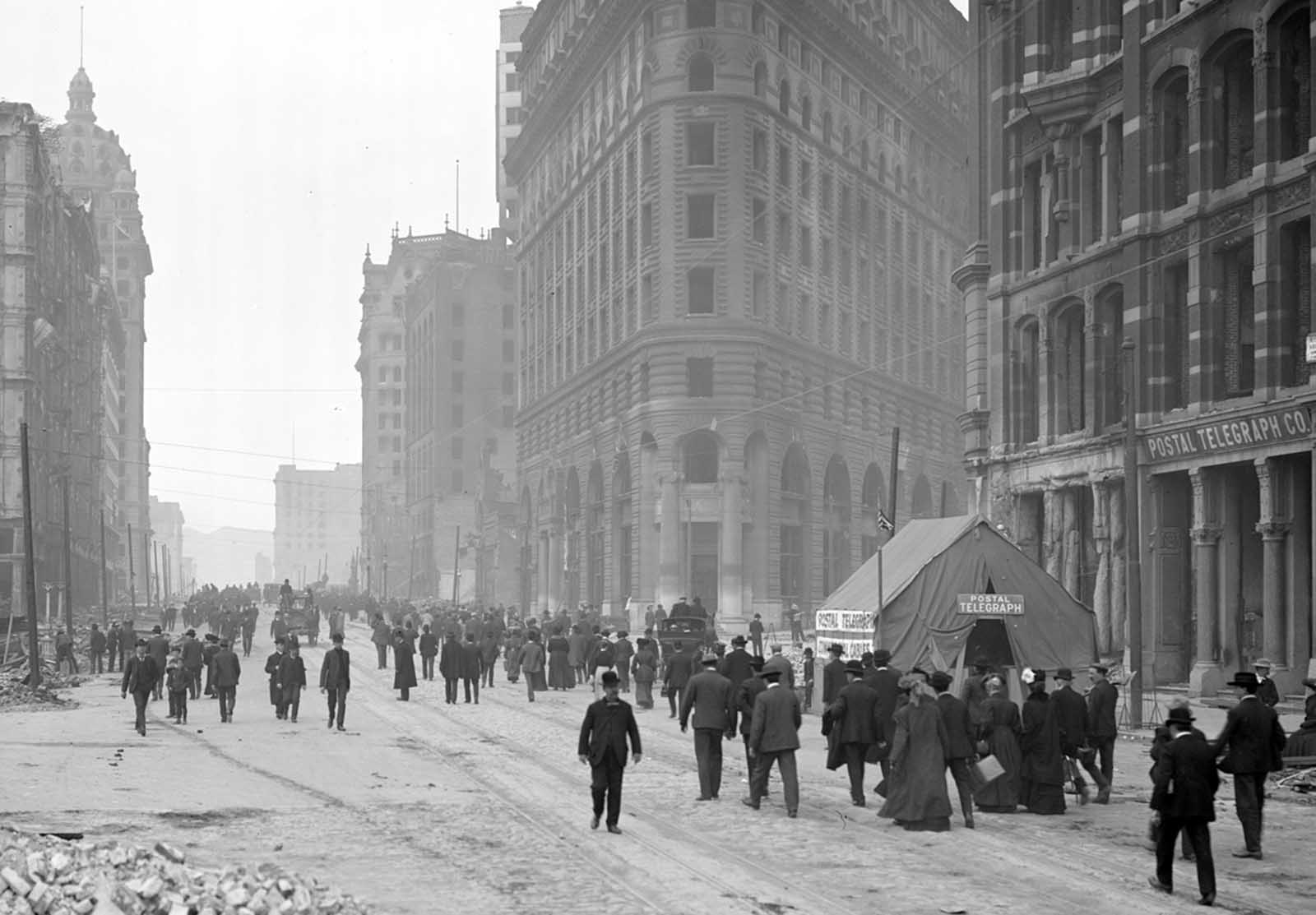 A Postal Telegraph tent is set up on Market Street.