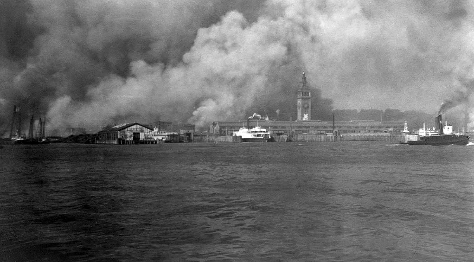 Smoke rises from burning buildings on the waterfront during the fire after the earthquake of 1906 in San Francisco, California.