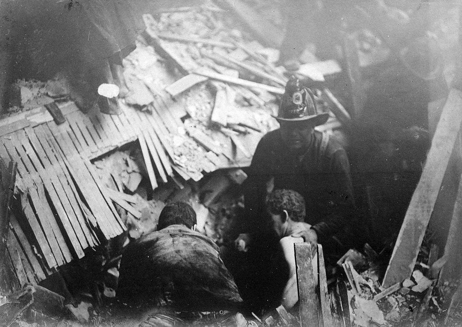 Rescue workers helping survivors in the wreckage.