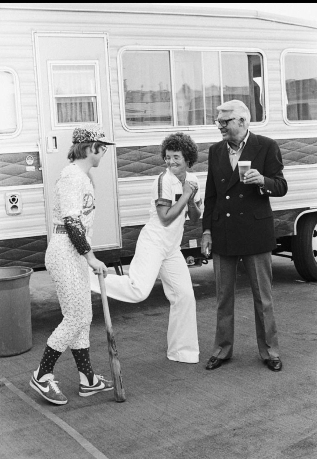 Elton John with Billie Jean King and Cary Grant backstage at Dodger Stadium, October 1975