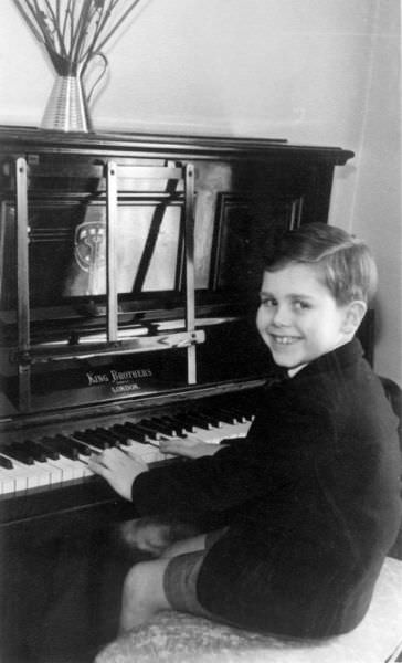 Elton playing piano at age 6 in Pinner, England