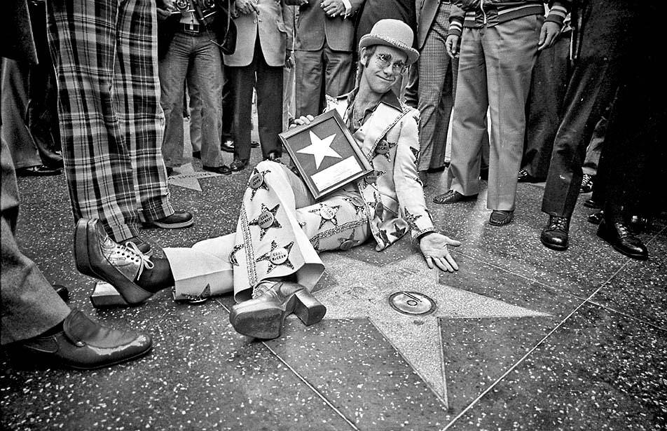 Elton John at his Walk of Fame star, 1975