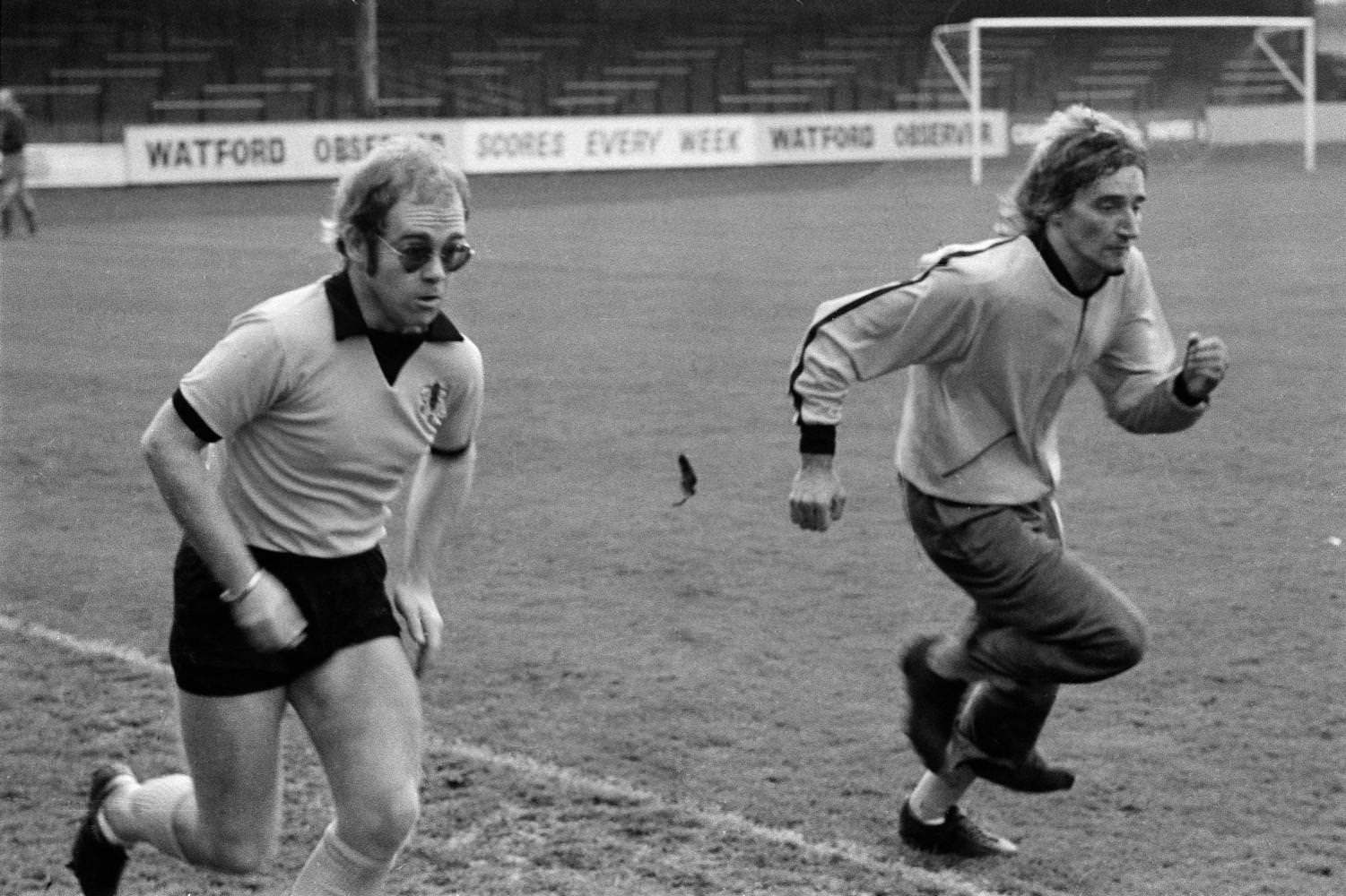 Elton john and Rod Stewart training with Watford Football club, 1974