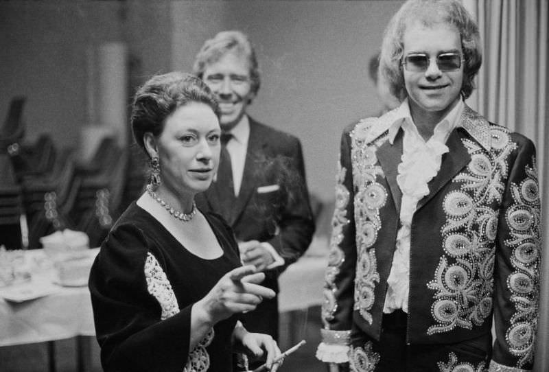 Princess Margaret and her husband, Lord Snowdon, join Elton John backstage at a benefit concert in London in 1972