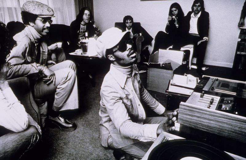 Stevie Wonder backstage at the Rainbow Theatre, using a cassette player, on January 30, 1974 in London