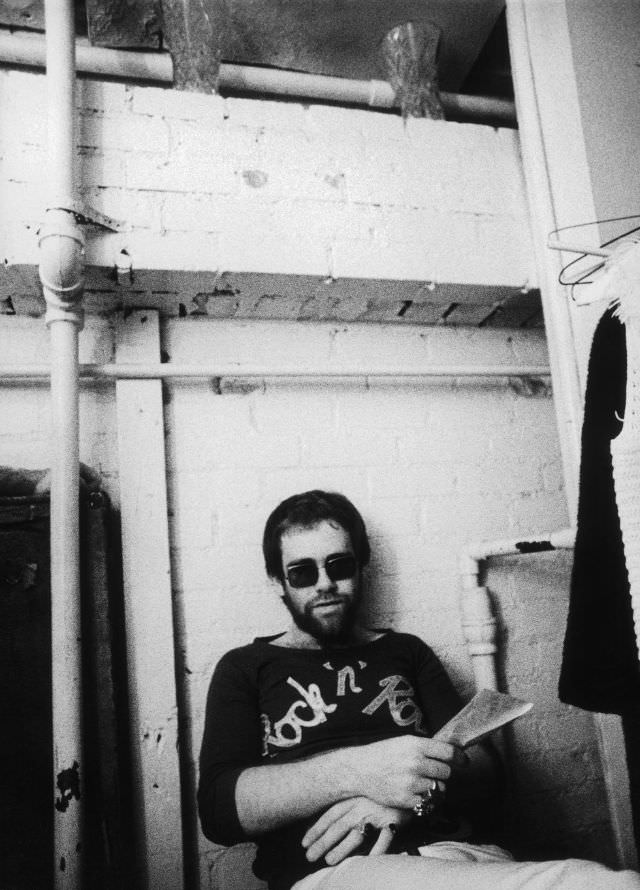 Elton John relaxes backstage at Doug Weston's Troubadour on August 25, 1970 in Los Angeles (now West Hollywood), California