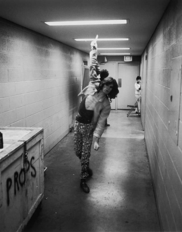 Mick Jagger practices his bowling in the corridor during the Rolling Stones Tour of the Americas, 1975