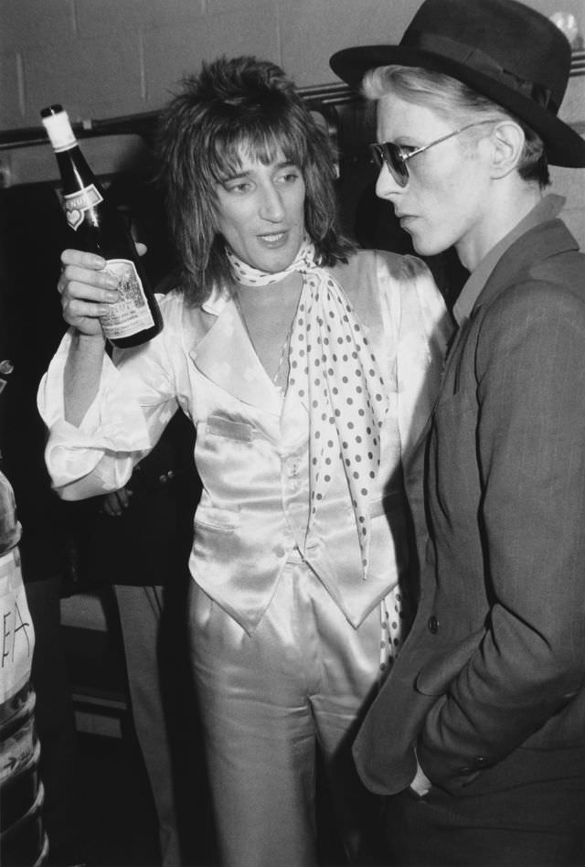Rod Stewart chats with David Bowie backstage after a performance at Madison Square Garden in 1975