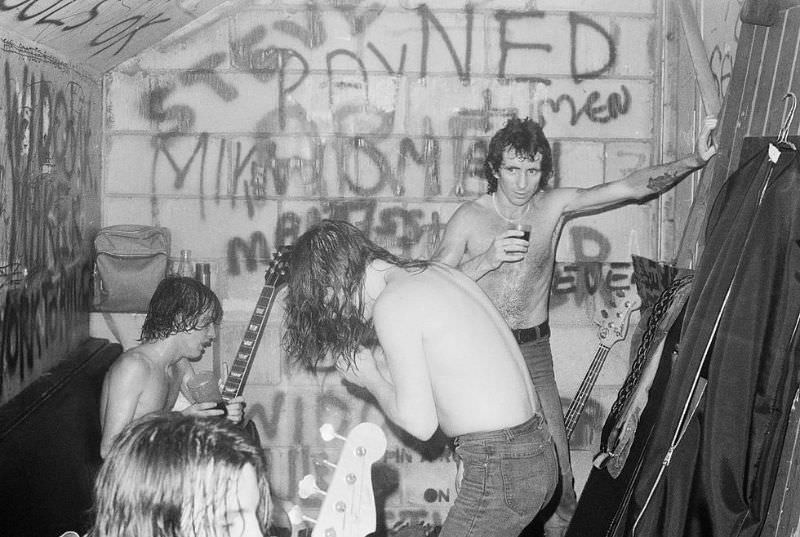 AC/DC celebrates after a successful performance at the Marquee Club in London in 1976