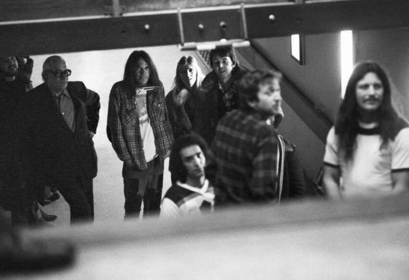Neil Young (3rd from left) and Frank Sampedro and Ralph Molina of Crazy Horse stand backstage with Paul McCartney and Linda McCartney at the Kuip stadium in Rotterdam, Netherlands in 1976