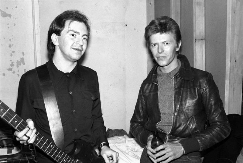 David Bowie and Gerald Casale of Devo pose backstage on November 14, 1977 at Max's in Kansas City