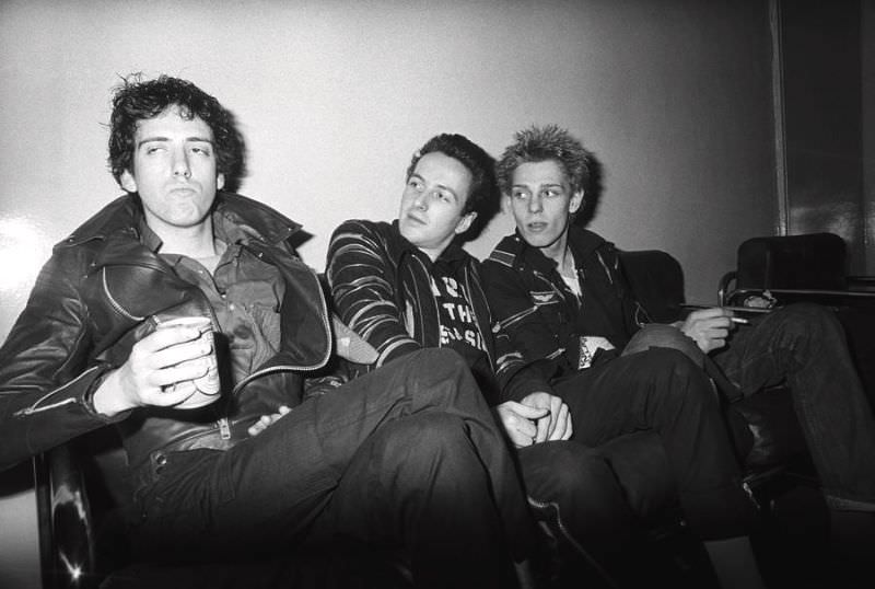 Joe Strummer, Paul Simonon, and Mick Jones of the Clash backstage at the Rainbow Theatre on the White Riot tour on June 9, 1977